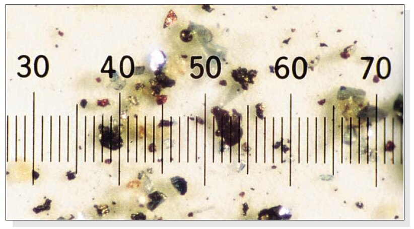 Actual photomicrograph of particulate contamination 